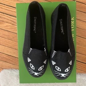 Black cat slip-on flats
